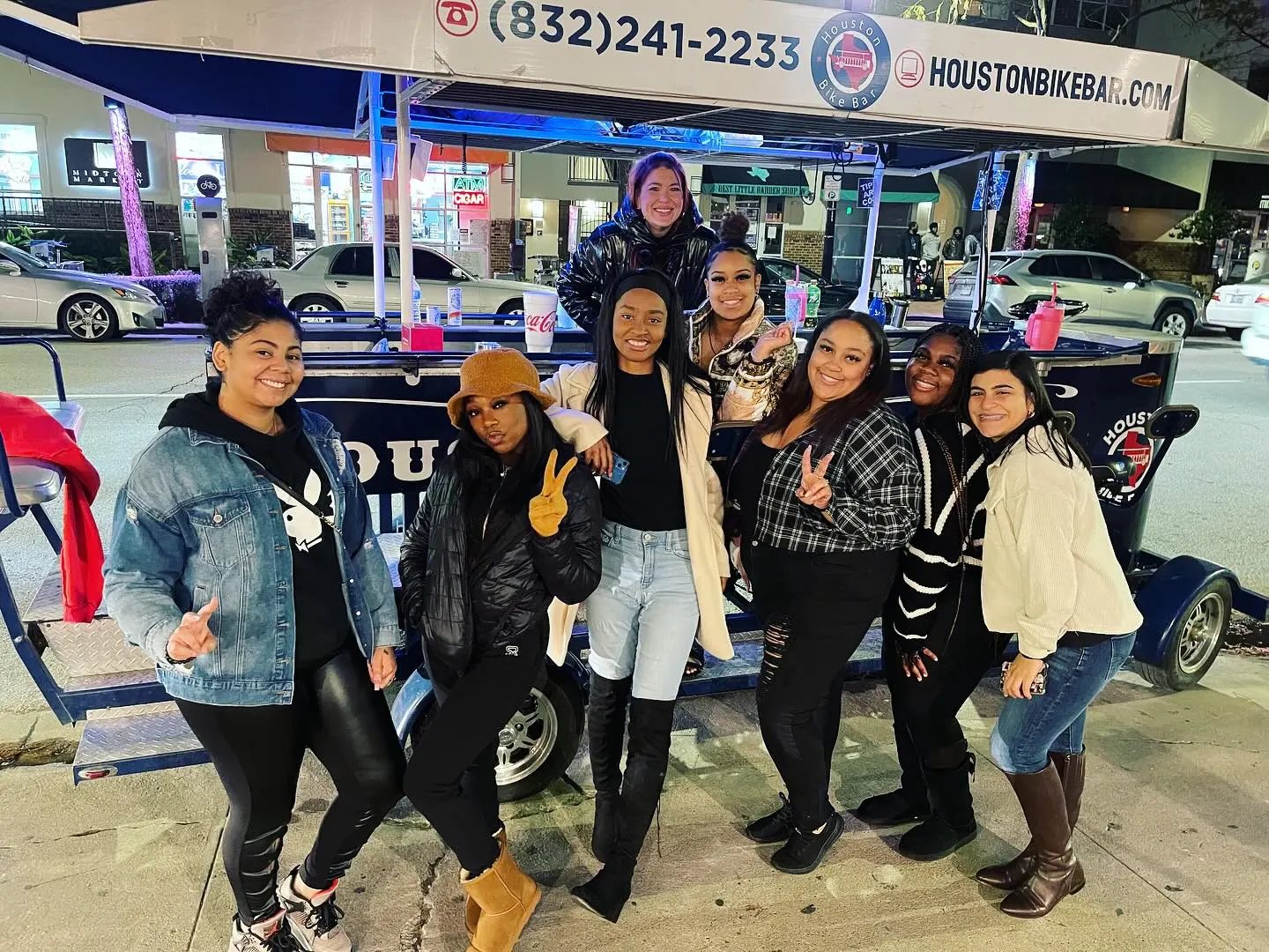 A group on a Midtown bar crawl at night