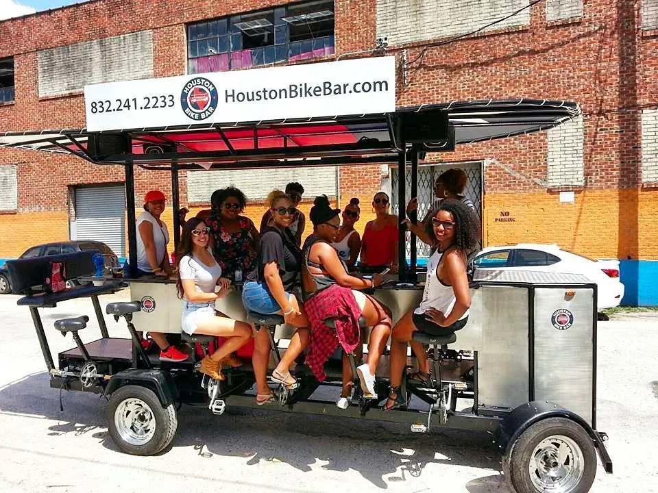 A large daytime group beside the bike bar