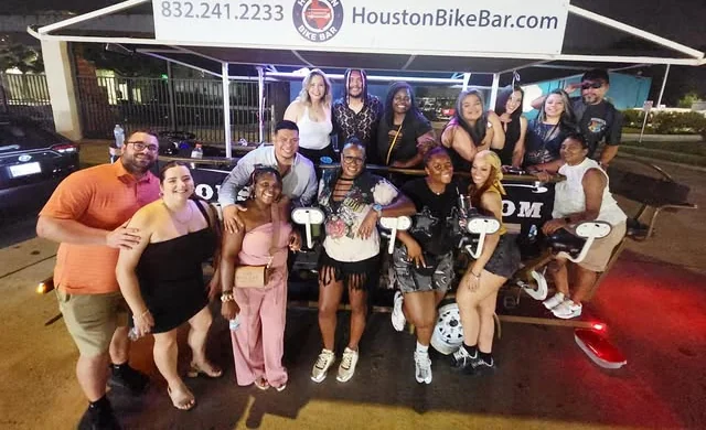 Riders on the Houston Bike Bar during a night tour