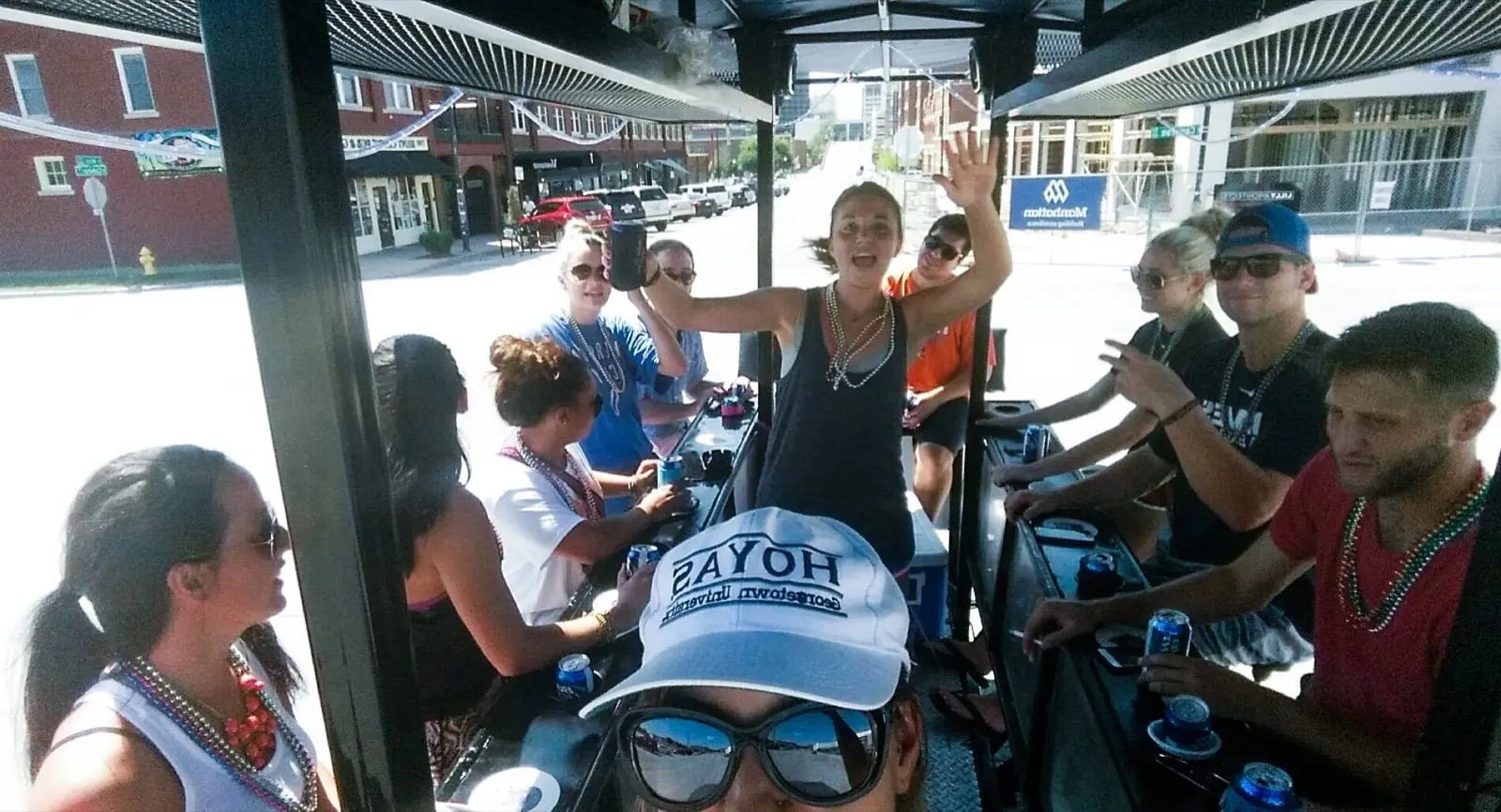 Riders on board the bike bar with drinks in the holders